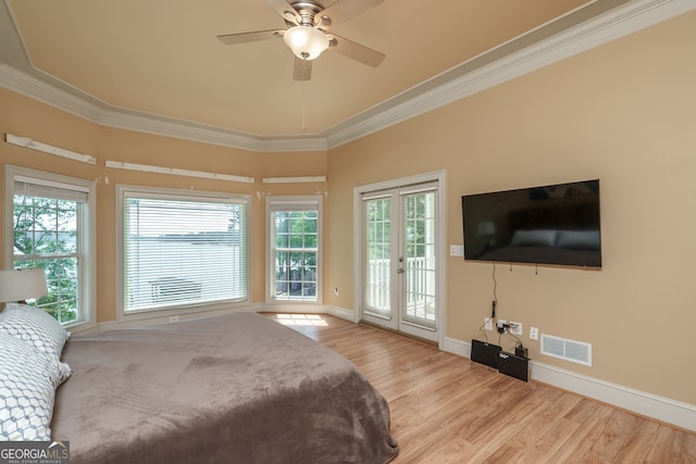 bedroom featuring ceiling fan, access to outside, light wood-type flooring, ornamental molding, and french doors