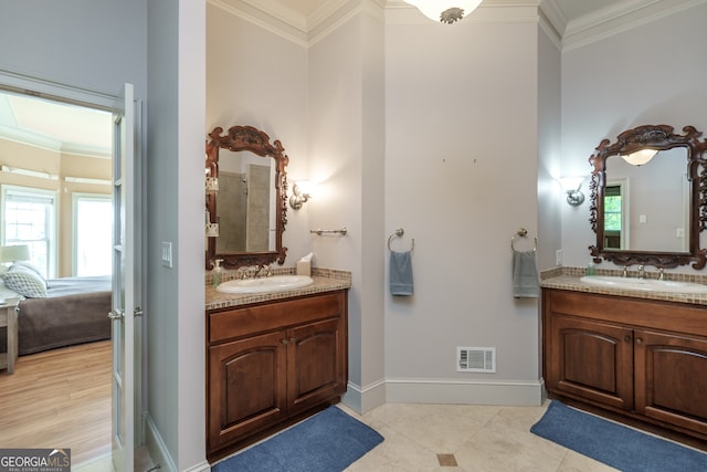 bathroom featuring vanity and crown molding