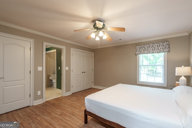 bedroom with connected bathroom, ornamental molding, light hardwood / wood-style flooring, and ceiling fan