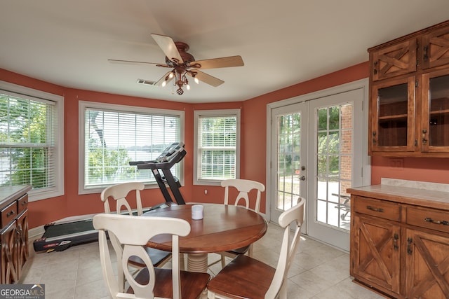 dining room featuring french doors, ceiling fan, and light tile patterned floors