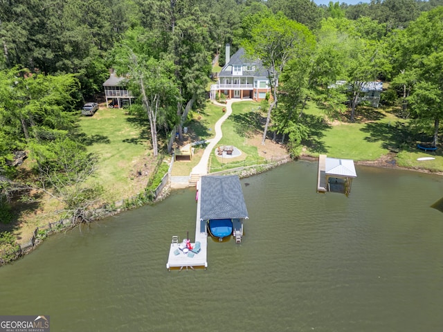 birds eye view of property with a water view