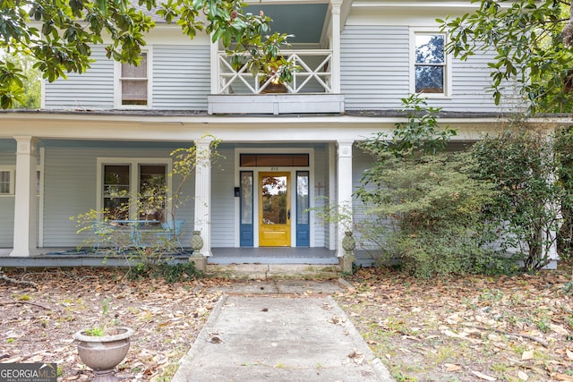 doorway to property featuring covered porch