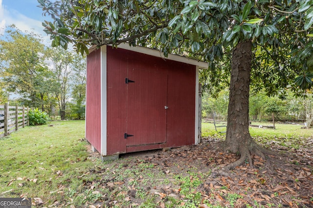 view of outdoor structure with a lawn