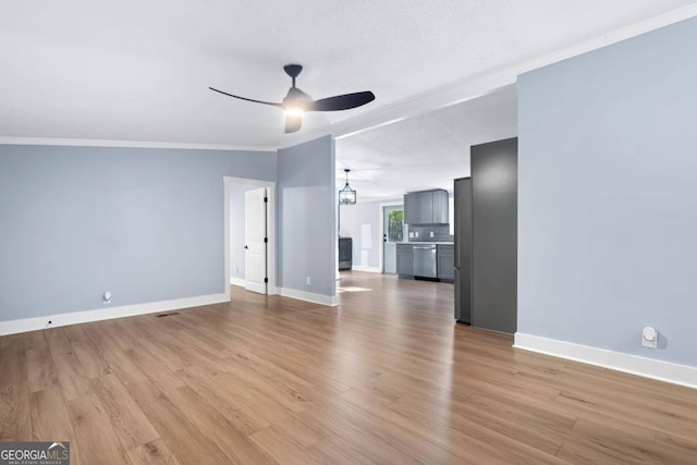 unfurnished living room with crown molding, a textured ceiling, light wood-type flooring, and ceiling fan