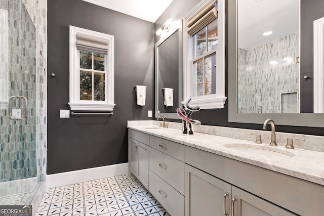 bathroom with vanity, tile patterned floors, and an enclosed shower