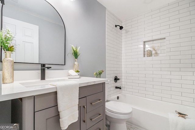 full bath featuring vanity,  shower combination, and toilet