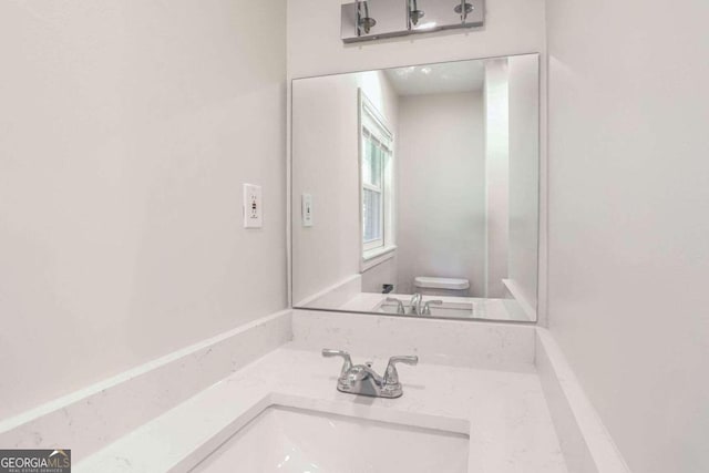 bathroom with vanity and toilet