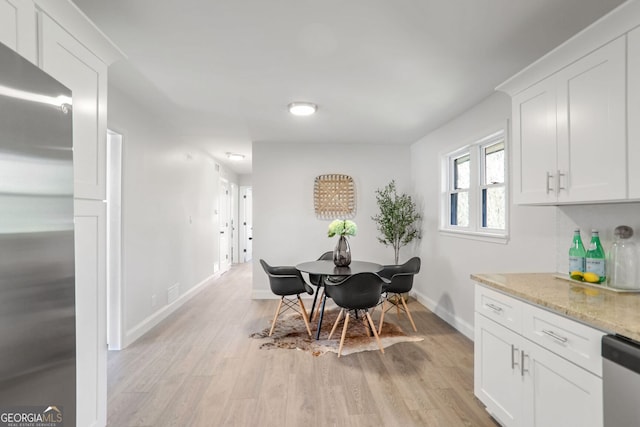 dining space featuring light hardwood / wood-style floors