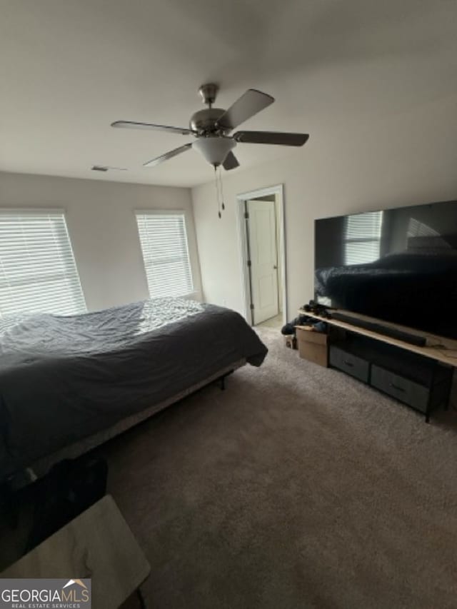 carpeted bedroom with ceiling fan