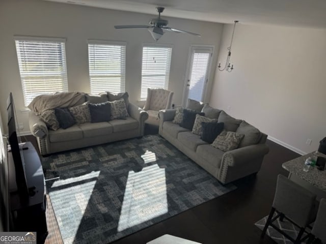 living room with a wealth of natural light and ceiling fan