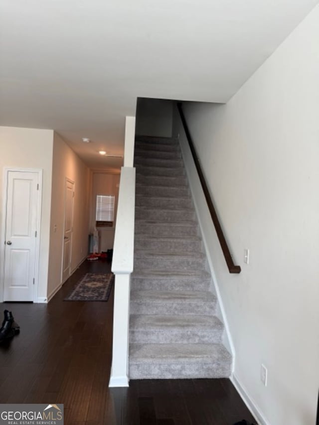 stairs with wood-type flooring