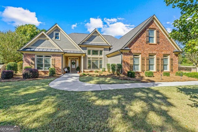 craftsman inspired home with a front yard