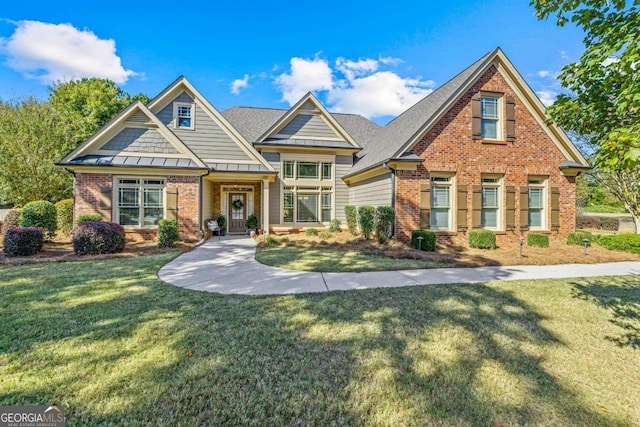 craftsman inspired home with a front yard