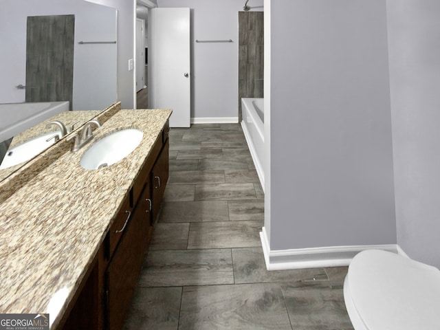 bathroom with vanity, hardwood / wood-style floors, and toilet