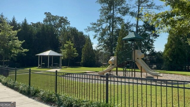 view of jungle gym with a gazebo and a lawn