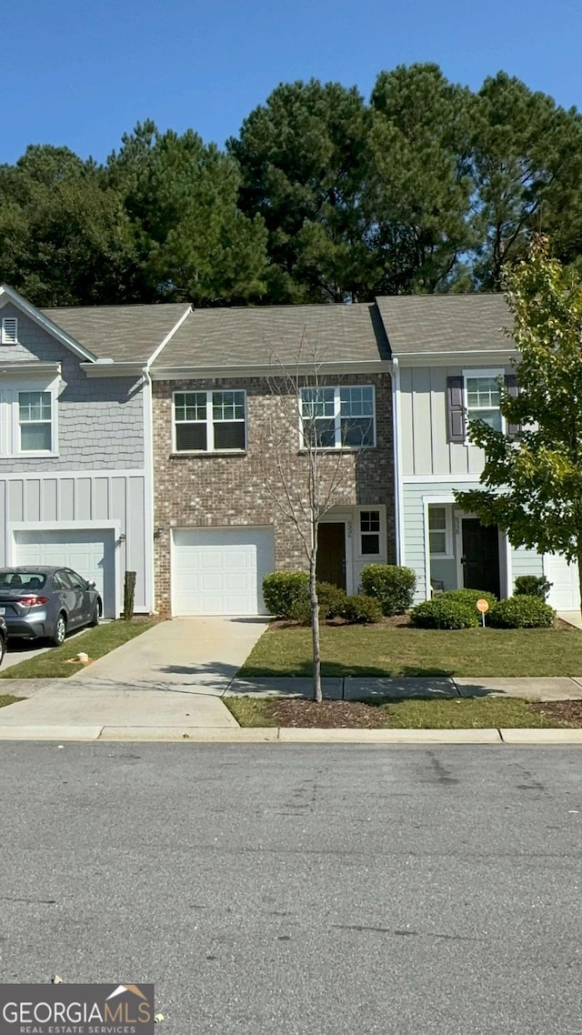 multi unit property featuring a garage