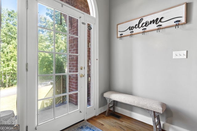 entryway with hardwood / wood-style flooring