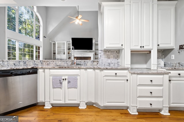 kitchen featuring white cabinetry, light hardwood / wood-style floors, dishwasher, and ceiling fan