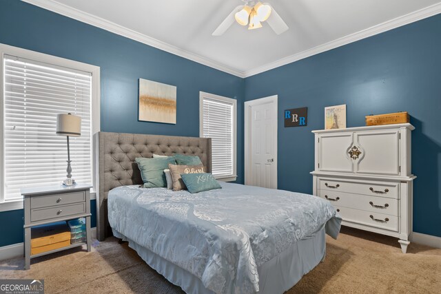 bedroom with light carpet, crown molding, and ceiling fan