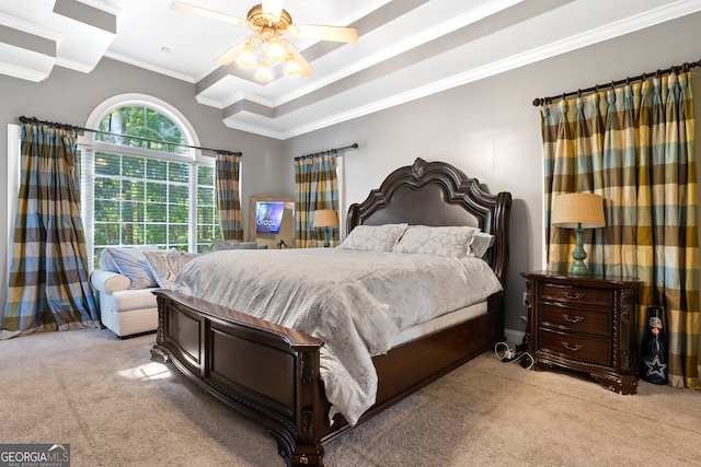 carpeted bedroom with ornamental molding and ceiling fan