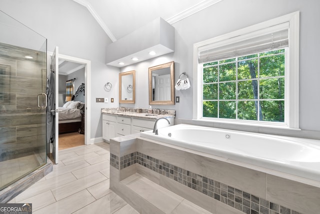 bathroom featuring vanity, vaulted ceiling, plus walk in shower, and tile patterned floors