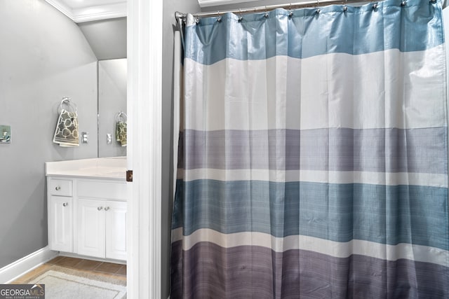 bathroom featuring vanity, curtained shower, and hardwood / wood-style floors