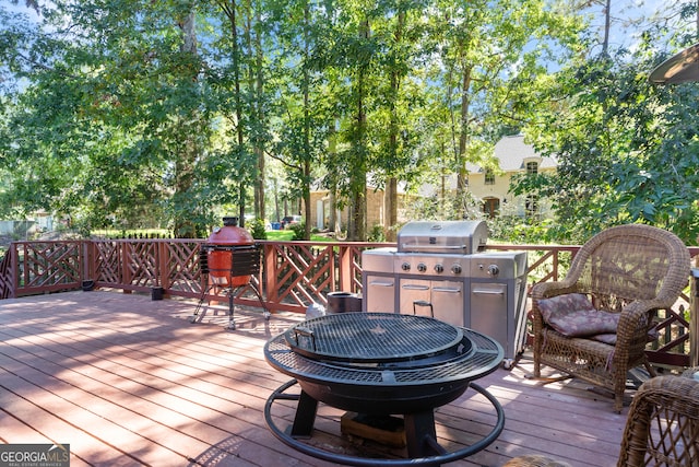 wooden terrace featuring a grill