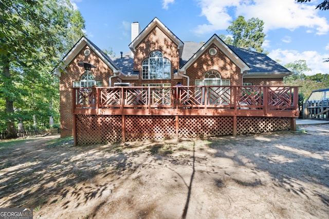 back of house featuring a deck