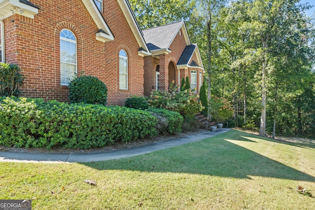 view of home's exterior featuring a yard