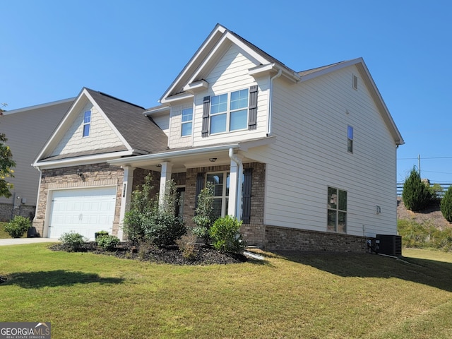 craftsman-style house featuring a front lawn, an attached garage, brick siding, and central air condition unit