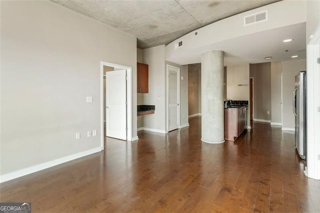 unfurnished room with dark hardwood / wood-style floors