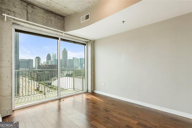 spare room featuring hardwood / wood-style floors