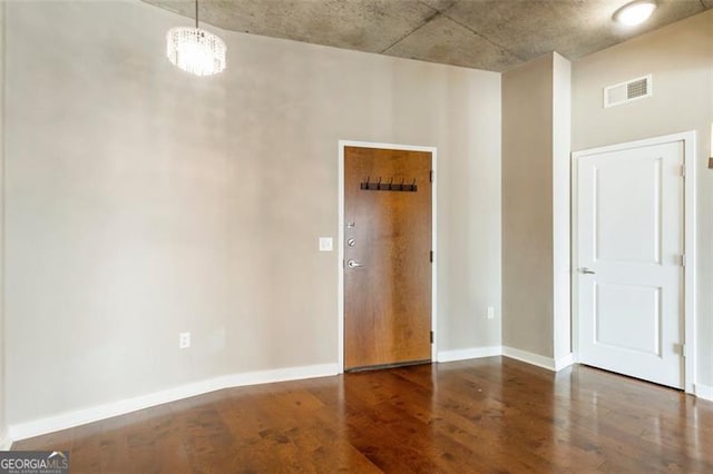 empty room featuring dark hardwood / wood-style flooring