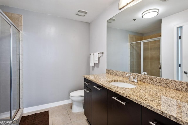 bathroom with toilet, walk in shower, vanity, and tile patterned floors