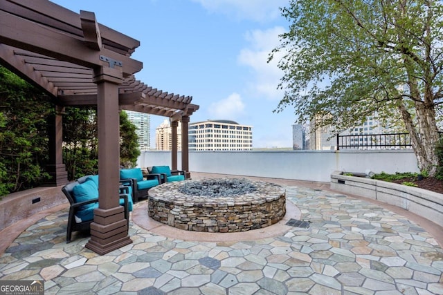 view of patio / terrace featuring a pergola and a fire pit