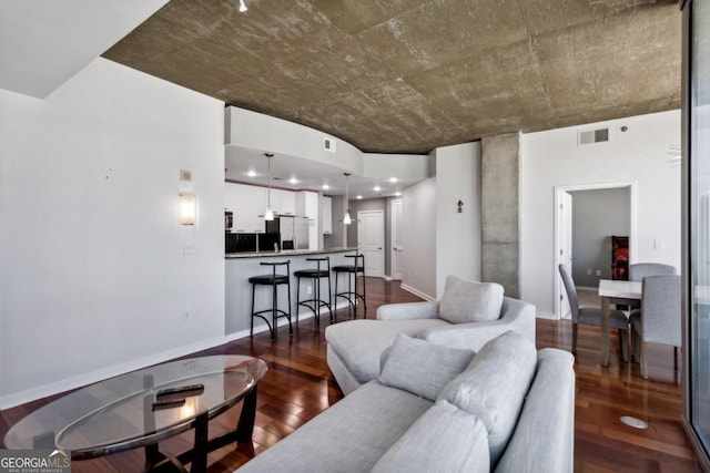 living room featuring dark wood-type flooring