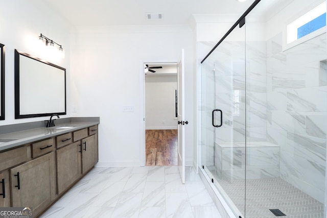 full bath with visible vents, marble finish floor, a shower stall, crown molding, and baseboards