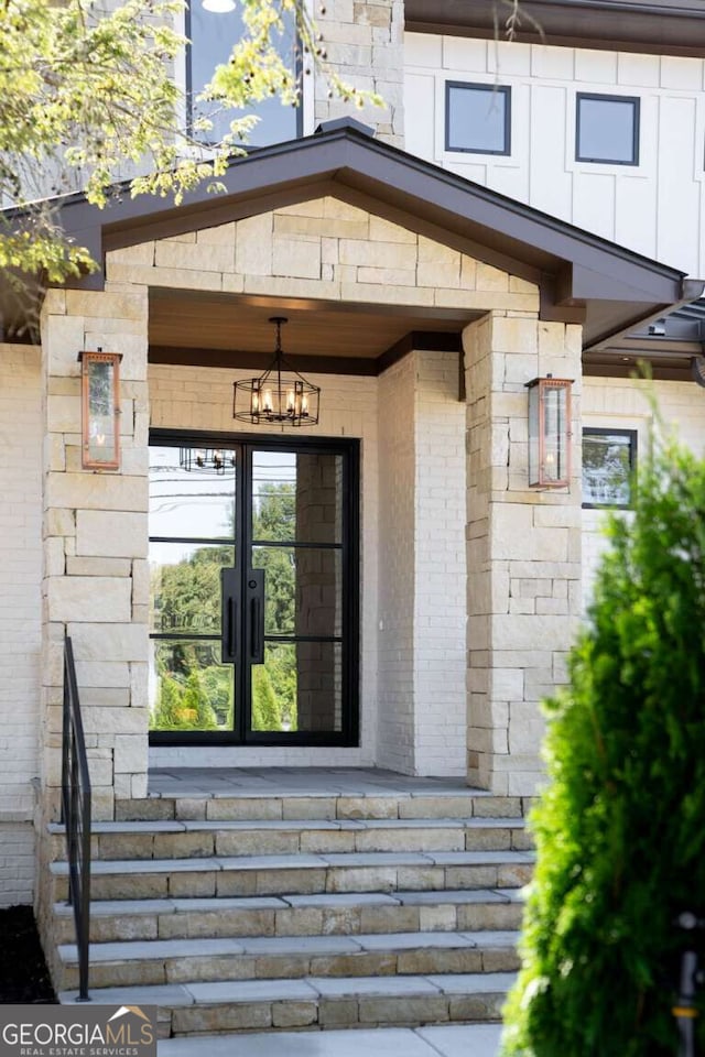 doorway to property featuring french doors