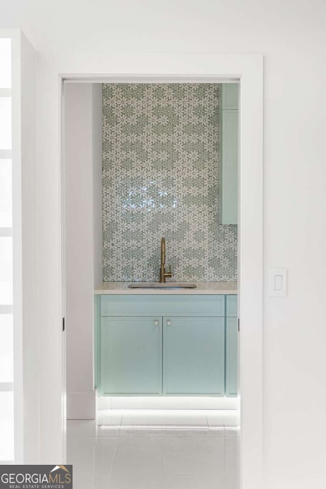 bathroom with decorative backsplash and vanity