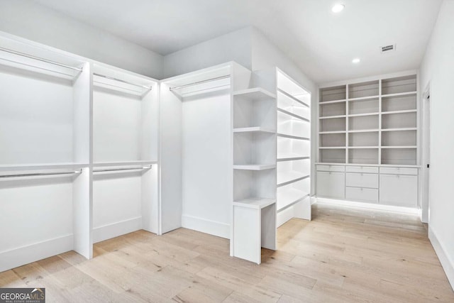 spacious closet featuring light wood-type flooring