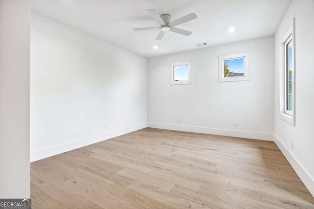 spare room featuring ceiling fan and light hardwood / wood-style floors