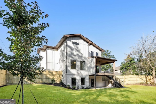 rear view of house with a lawn