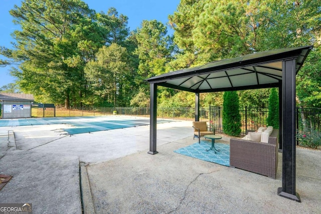 view of swimming pool with a gazebo and a patio area