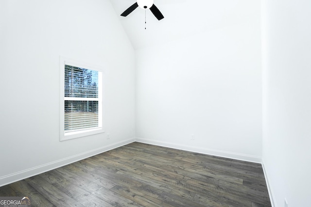 spare room with high vaulted ceiling, dark wood-style floors, baseboards, and ceiling fan