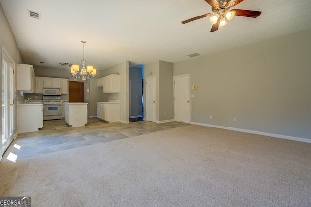 unfurnished living room with a chandelier, light colored carpet, a ceiling fan, a sink, and baseboards