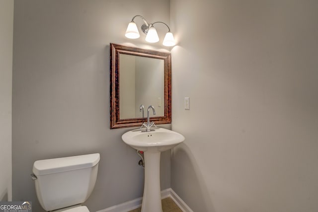 half bath featuring toilet