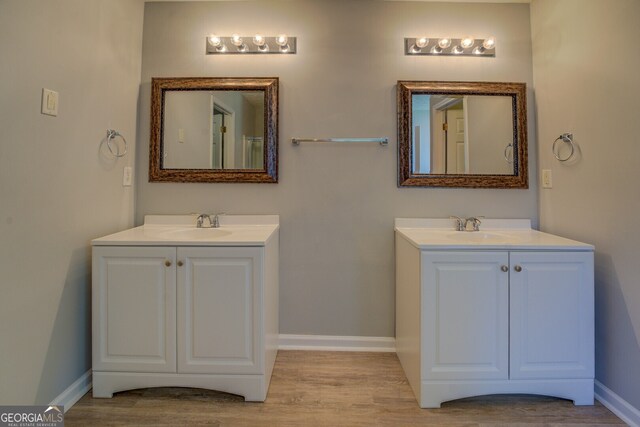 bathroom with vanity and hardwood / wood-style floors