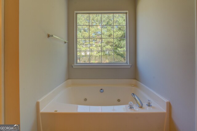 bathroom featuring a tub to relax in