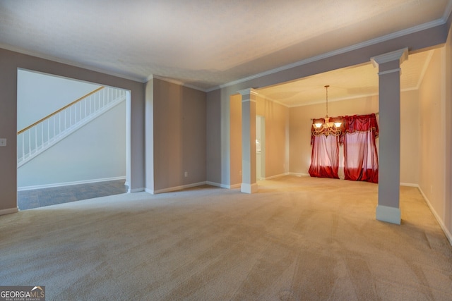 unfurnished living room with ornamental molding, a chandelier, carpet floors, decorative columns, and baseboards