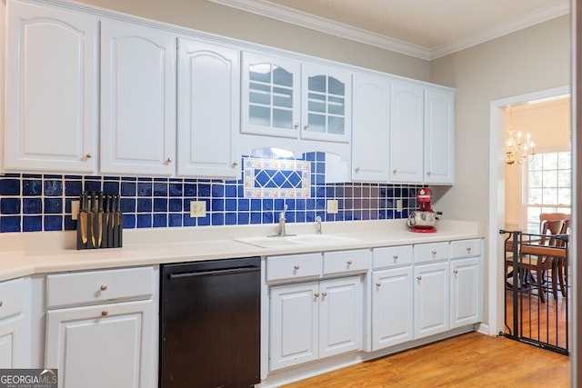 kitchen featuring white cabinets, black dishwasher, light wood-type flooring, crown molding, and sink